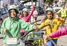 KEY WEST MARCHES IN MEMORY OF MLK a group of people riding bikes down a street