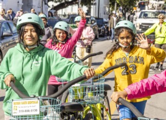 KEY WEST MARCHES IN MEMORY OF MLK a group of people riding bikes down a street