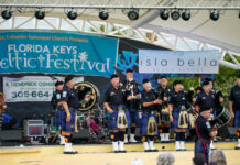 a group of people that are standing on a stage
