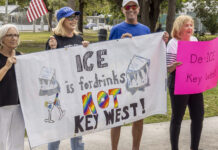a group of people holding a protest sign