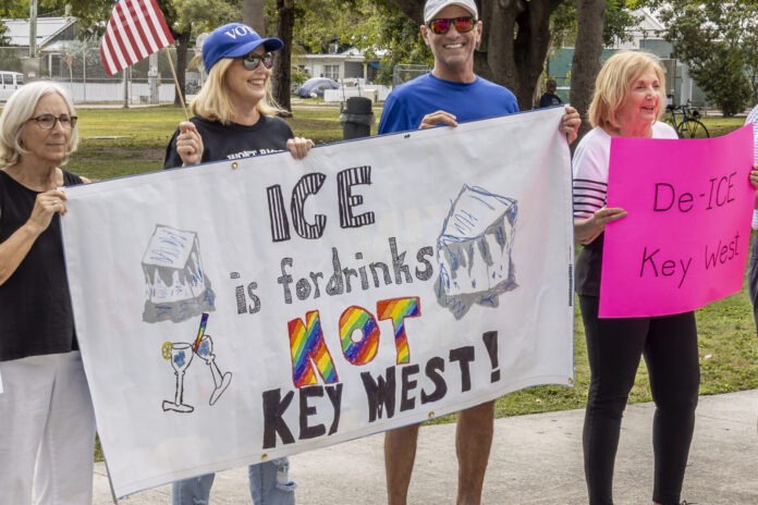a group of people holding a protest sign