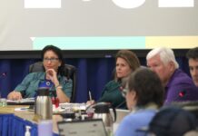 a group of people sitting around a table