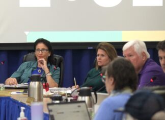 a group of people sitting around a table