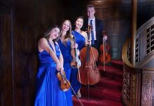 a group of young women standing next to each other