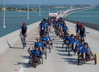 WOUNDED WARRIORS RIDE THROUGH THE FLORIDA KEYS BEGINNING THIS FRIDAY a group of people riding bikes down a road