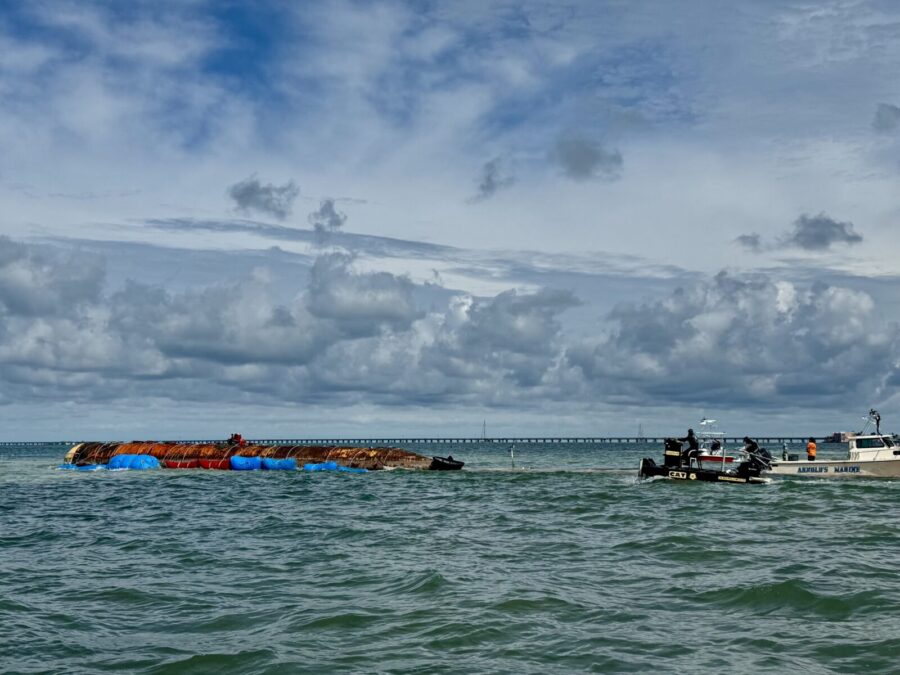 a group of people on a boat in the water