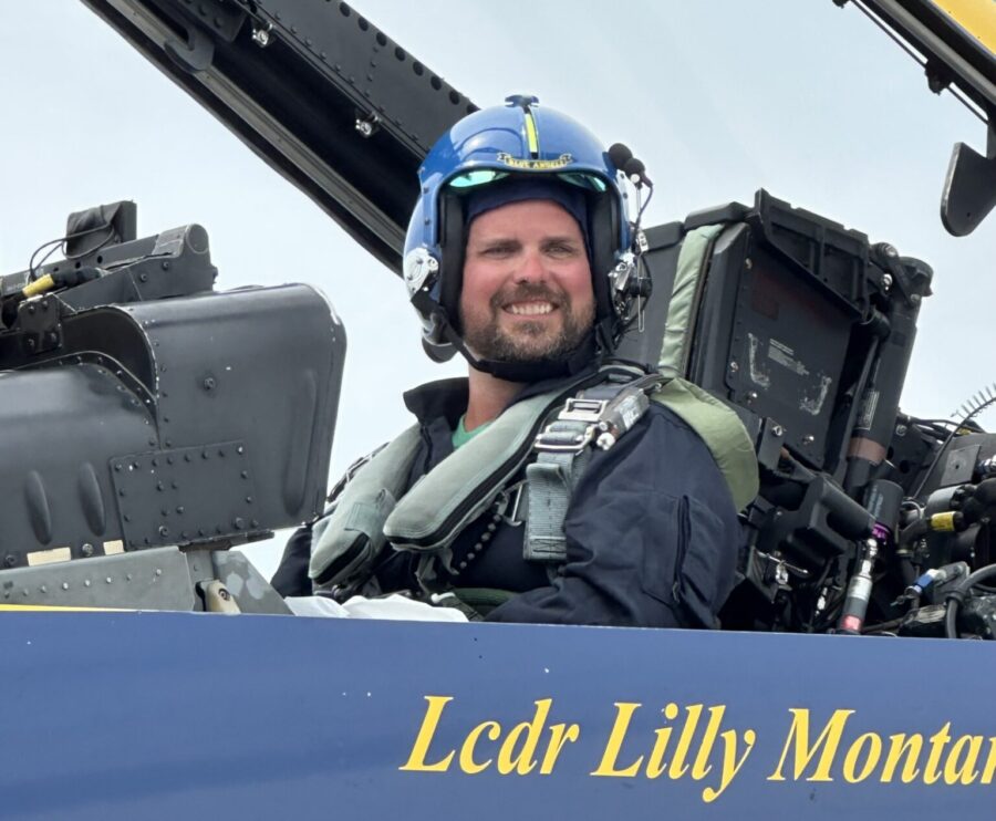 a man sitting in the cockpit of a plane