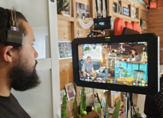 FILM CREW IS SHOOTING A MOVIE IN KEY WEST THIS MONTH a man with a beard is looking at a video camera