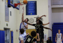 NO DAYS OFF FOR KEY WEST & MARATHON HOOPERS a group of young men playing a game of basketball