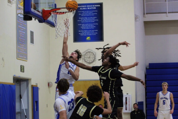 image5 (1) a group of young men playing a game of basketball