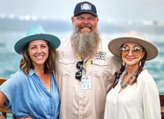 KYLE CARTER BRINGS THE MAGIC OF MILE 0 FEST BACK TO KEY WEST a man with a long beard standing next to two women