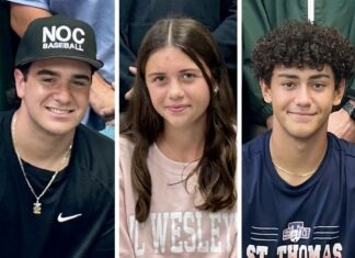 THREE HURRICANES SIGN LETTERS OF INTENT TO CONTINUE ATHLETIC CAREERS a group of young people sitting next to each other
