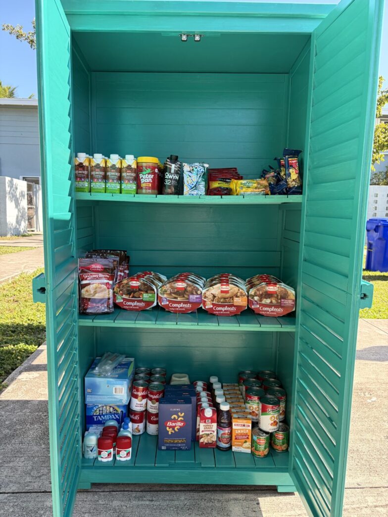a green shelf filled with lots of food