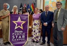 SCHOOL BOARD BRIEFED ON CYBERSECURITY; NAVY CAPTAIN RECOGNIZES PURPLE STAR INSTITUTIONS