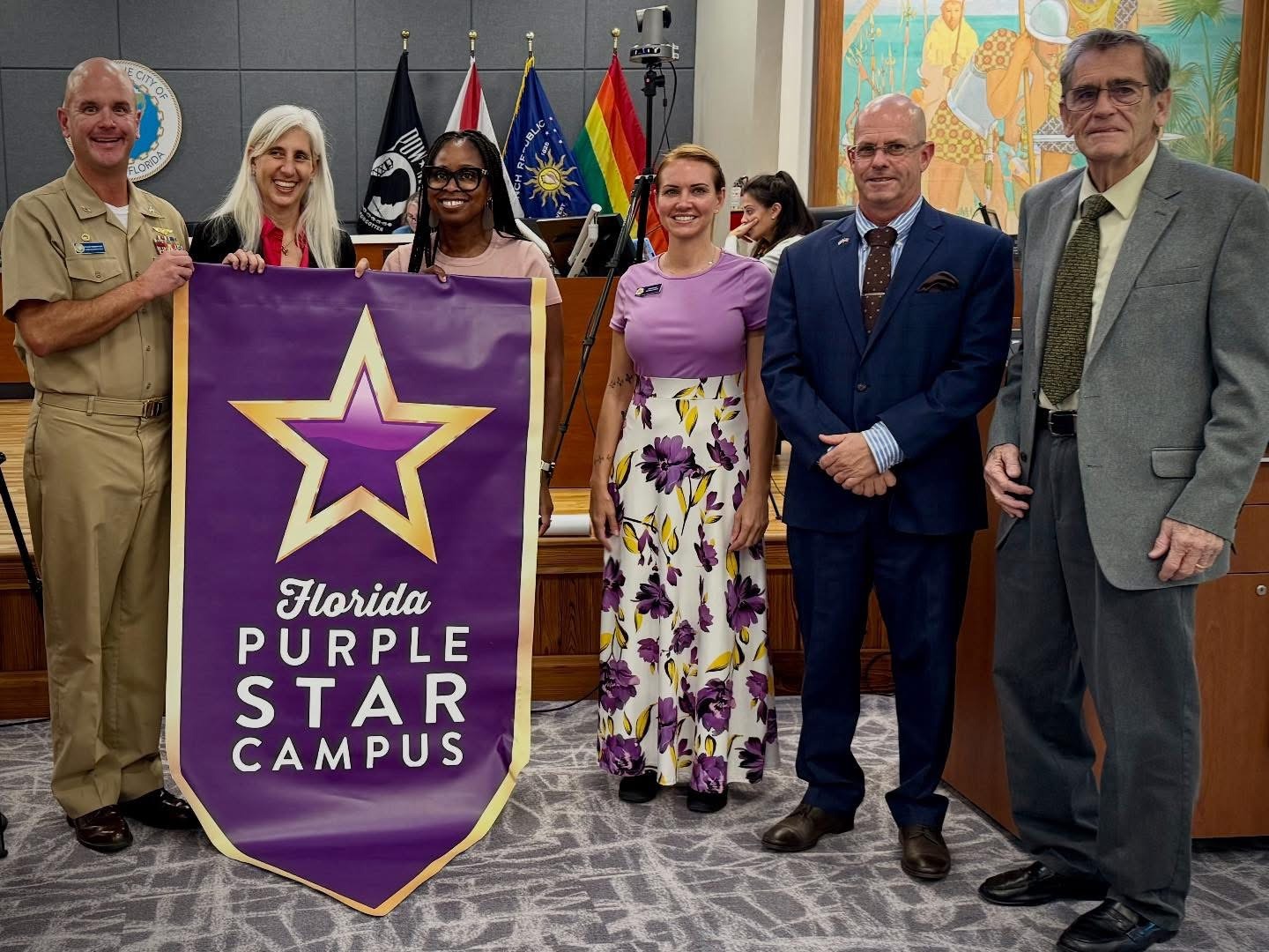 SCHOOL BOARD BRIEFED ON CYBERSECURITY; NAVY CAPTAIN RECOGNIZES PURPLE STAR INSTITUTIONS