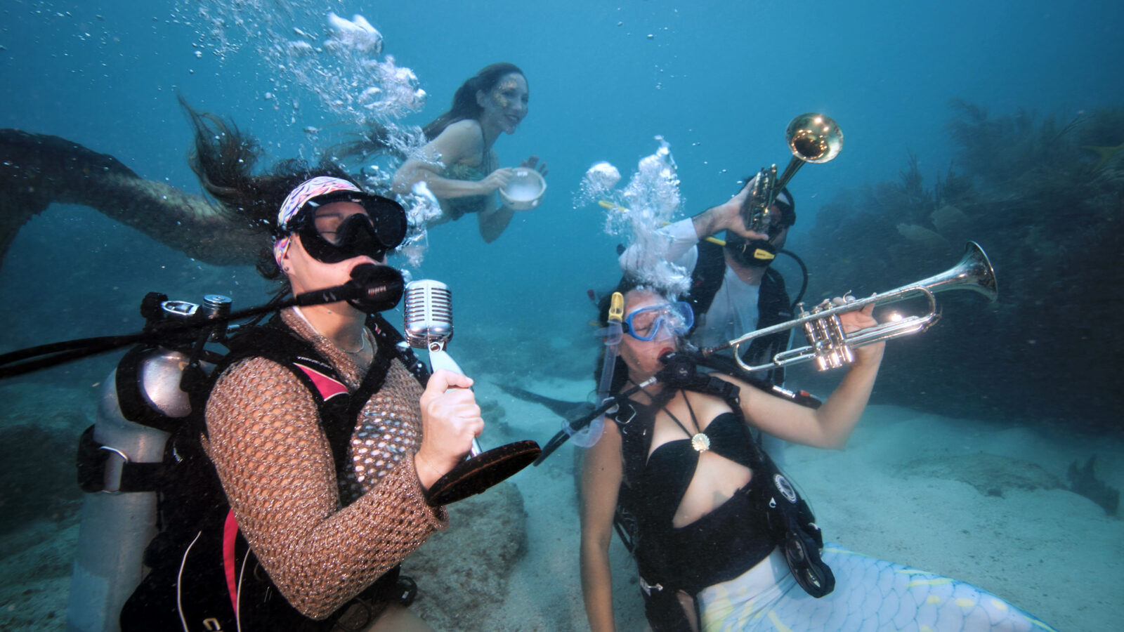In Pictures: Divers and mermaids jam sub-sea tunes at Underwater Music Fest